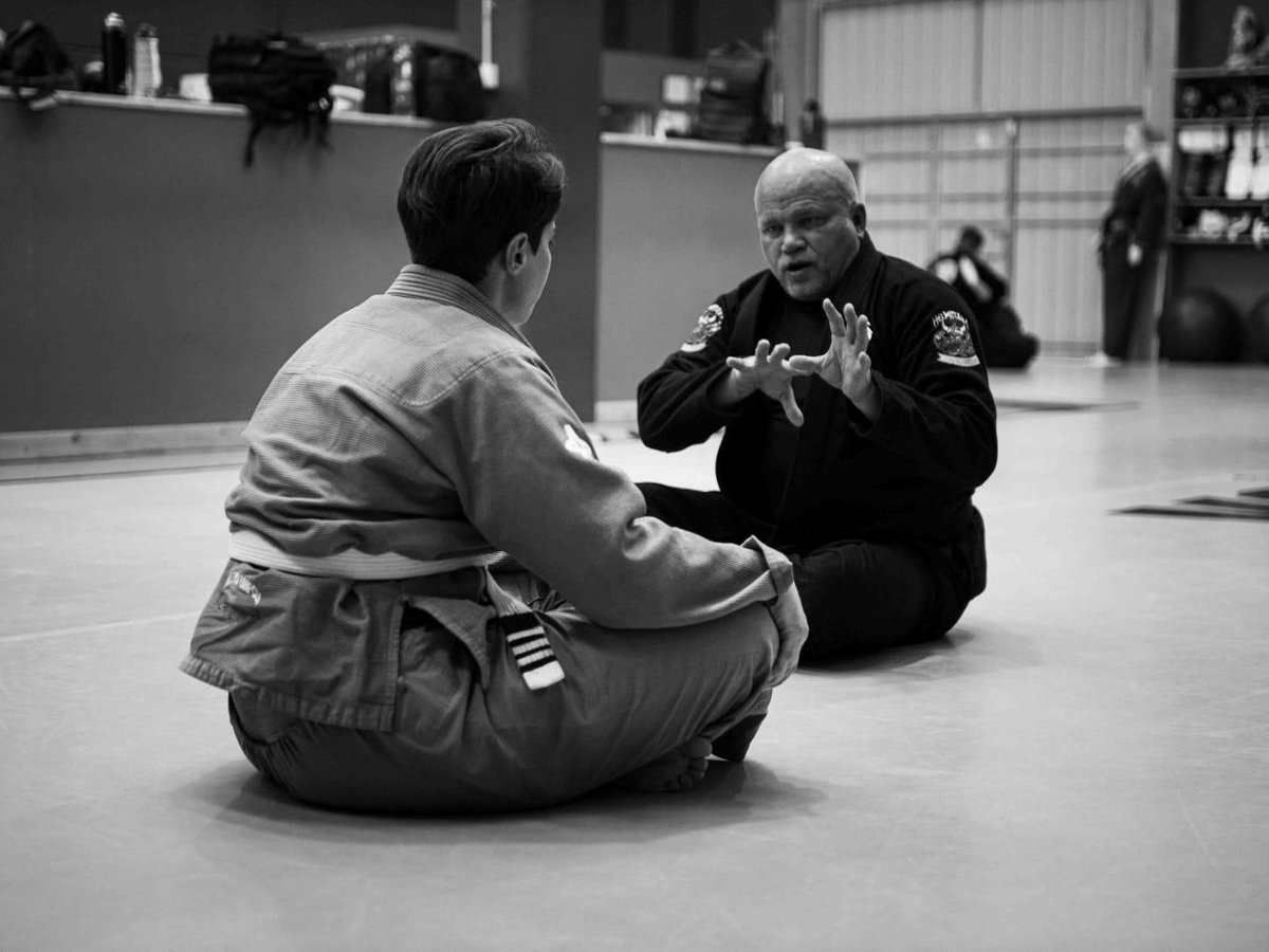 Coach teaching a student at KongJitsu Academy